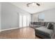 Comfortable living room featuring a cozy sectional sofa and bright natural light at 4741 N 85Th Ave, Phoenix, AZ 85037