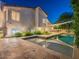 Beautiful backyard featuring a pool, well-manicured landscaping, and an outdoor dining area for entertaining at 4748 E Redfield Rd, Phoenix, AZ 85032