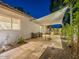 Private backyard with covered patio and built-in grill is ideal for outdoor entertaining and dining at 4748 E Redfield Rd, Phoenix, AZ 85032