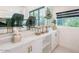 Modern bar area featuring white cabinetry and marble countertops at 4748 E Redfield Rd, Phoenix, AZ 85032