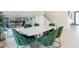 Dining room with large windows and modern green velvet chairs at 4748 E Redfield Rd, Phoenix, AZ 85032