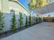 Long driveway featuring a sun shade, and a minimalist landscaped garden bed alongside a privacy wall at 4748 E Redfield Rd, Phoenix, AZ 85032