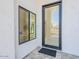 Elegant home entrance featuring a modern glass door and sleek, contemporary design at 4748 E Redfield Rd, Phoenix, AZ 85032