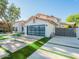 Contemporary home with a modern garage door, clean landscaping, and a stylish, geometric driveway at 4748 E Redfield Rd, Phoenix, AZ 85032