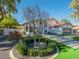 Charming home featuring lush landscaping, a modern garage door, and a stylish circular garden at 4748 E Redfield Rd, Phoenix, AZ 85032