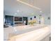 Open-concept living area with kitchen bar and fireplace feature wall at 4748 E Redfield Rd, Phoenix, AZ 85032
