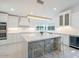 Modern kitchen with large island, seating, and stainless steel appliances at 4748 E Redfield Rd, Phoenix, AZ 85032
