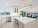 Kitchen featuring a large marble island, stainless steel appliances, and a view of the dining area and backyard at 4748 E Redfield Rd, Phoenix, AZ 85032