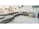 Open-concept living room with modern gray sofa and stylish decor at 4748 E Redfield Rd, Phoenix, AZ 85032