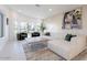 Bright living room with modern furniture, large windows, and stylish decor at 4748 E Redfield Rd, Phoenix, AZ 85032