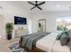 Spacious bedroom featuring neutral tones, a ceiling fan, and large windows, with natural light at 4748 E Redfield Rd, Phoenix, AZ 85032