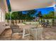 Spacious covered patio with dining area and outdoor kitchen offers a perfect setting for entertaining and relaxation at 4748 E Redfield Rd, Phoenix, AZ 85032