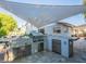 Outdoor kitchen with stainless steel grill and sink, perfect for poolside entertaining at 4748 E Redfield Rd, Phoenix, AZ 85032