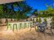 Outdoor kitchen area features a grill, bar seating, and a dining area, perfect for entertaining guests at 4748 E Redfield Rd, Phoenix, AZ 85032