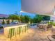 The covered outdoor kitchen and bar area are perfect for entertaining guests and enjoying outdoor dining at 4748 E Redfield Rd, Phoenix, AZ 85032