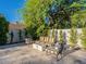 Charming patio area with cozy seating and a modern fire pit, surrounded by lush greenery at 4748 E Redfield Rd, Phoenix, AZ 85032