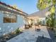 Charming outdoor patio with shaded seating area and stylish stone pavers at 4748 E Redfield Rd, Phoenix, AZ 85032