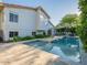 Beautiful backyard featuring a sparkling pool with a baja shelf and mature landscaping around the home at 4748 E Redfield Rd, Phoenix, AZ 85032