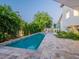 Exterior showcasing a sparkling pool, a covered dining area, and manicured landscaping around the property at 4748 E Redfield Rd, Phoenix, AZ 85032
