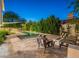 Relaxing backyard pool area with comfortable lounge seating perfect for evening enjoyment and landscaped greenery at 4748 E Redfield Rd, Phoenix, AZ 85032