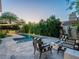 Inviting backyard pool with lounge area and lush landscaping provides a private outdoor retreat at 4748 E Redfield Rd, Phoenix, AZ 85032
