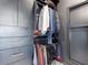 Well-organized walk-in closet with hanging clothes, built-in drawers, and a modern design at 4748 E Redfield Rd, Phoenix, AZ 85032