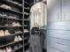 Organized walk-in closet with shelves for shoes and clothes, and built-in drawers at 4748 E Redfield Rd, Phoenix, AZ 85032