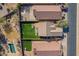 An aerial view showcasing the property layout, including a well manicured backyard and a swimming pool at 48069 N Rico Way, Gold Canyon, AZ 85118