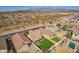 Aerial view of a neighborhood featuring homes with well-kept yards and a community pool at 48069 N Rico Way, Gold Canyon, AZ 85118
