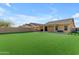 A spacious backyard with a well-maintained lawn and patio, great for outdoor activities at 48069 N Rico Way, Gold Canyon, AZ 85118