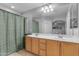 This bathroom includes a double sink vanity and a shower/tub combination at 48069 N Rico Way, Gold Canyon, AZ 85118