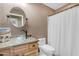 This bathroom has an eye-catching bowl sink and a shower-tub combination with a white curtain at 48069 N Rico Way, Gold Canyon, AZ 85118