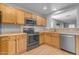 Bright kitchen with wooden cabinets and stainless steel appliances at 48069 N Rico Way, Gold Canyon, AZ 85118