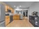 A well-equipped kitchen with stainless steel appliances and a view into the adjacent living room at 48069 N Rico Way, Gold Canyon, AZ 85118