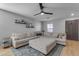 Living room featuring a large sectional sofa, ceiling fan, and neutral decor at 48069 N Rico Way, Gold Canyon, AZ 85118