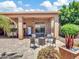 A cozy backyard featuring an outdoor seating area, a pool table, and manicured landscaping at 4935 W Lariat Ln, Phoenix, AZ 85083