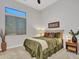 Cozy bedroom with a comfortable bed, soft lighting, and a large window with plantation shutters at 4935 W Lariat Ln, Phoenix, AZ 85083