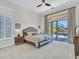 Serene bedroom featuring plush carpeting, slider to patio, neutral tones, and abundant natural light at 4935 W Lariat Ln, Phoenix, AZ 85083