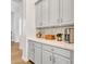 Butler pantry featuring sleek cabinetry, marble countertops, and modern appliances at 4935 W Lariat Ln, Phoenix, AZ 85083