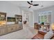 Open-concept living area features a work space and cozy seating at 4935 W Lariat Ln, Phoenix, AZ 85083