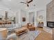 Bright living room offers a stone fireplace, wood floors, and comfortable seating at 4935 W Lariat Ln, Phoenix, AZ 85083