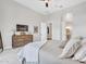 Spacious main bedroom with neutral tones, a dresser and tv, and ample closet space at 4935 W Lariat Ln, Phoenix, AZ 85083