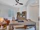 Home office with large wooden desk, built-in shelves, and natural light at 4935 W Lariat Ln, Phoenix, AZ 85083