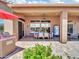 Covered patio with an outdoor dining table, grill, and drink machine, perfect for outdoor entertaining at 4935 W Lariat Ln, Phoenix, AZ 85083