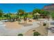Aerial view of a community playground with modern equipment and shaded seating at 4935 W Lariat Ln, Phoenix, AZ 85083