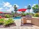 Backyard with a pristine pool, built-in BBQ, and mature palm trees for ultimate outdoor enjoyment at 4935 W Lariat Ln, Phoenix, AZ 85083