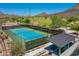 Aerial view of well-maintained tennis court and covered picnic area in community at 4935 W Lariat Ln, Phoenix, AZ 85083