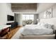 Modern bedroom with a balcony, minimalist decor, and a large bed with white linens at 5455 E Lincoln Dr # 3006, Paradise Valley, AZ 85253