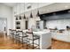 Modern kitchen featuring a large island, stainless steel appliances, and stylish pendant lighting at 5455 E Lincoln Dr # 3006, Paradise Valley, AZ 85253