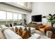 Modern living room featuring a comfortable sofa, stylish decor, and large windows with a view at 5455 E Lincoln Dr # 3006, Paradise Valley, AZ 85253